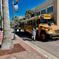 Students arriving for Let's Go Science show. Busses provided by the Foundation.