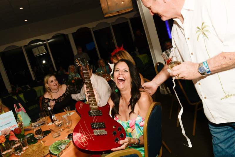 Renee Matusic takes home the Rick Springfield autographed guita